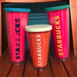 Three Starbucks cups.
